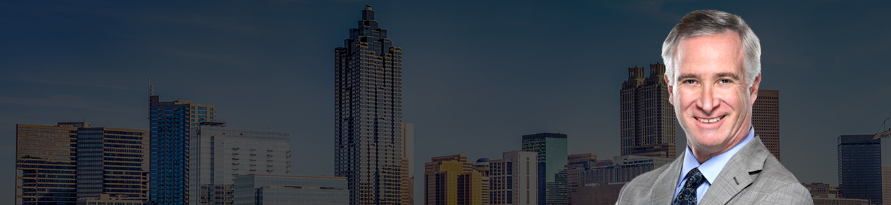 Attorney Picture over skyline of Atlanta